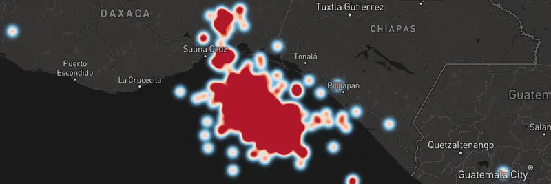 Dark map with a heatmap layer glowing red inside and white outside.